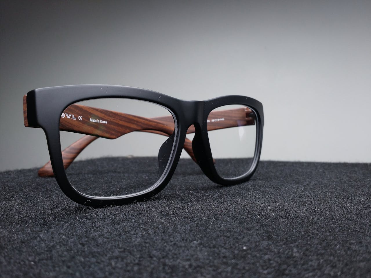 Black Framed Eyeglasses on Black Surface